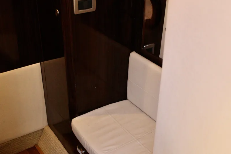 Slide: The Image of Interior seating area of 2017 Sea Ray Sundancer 350 Coupe with white upholstery. - 36