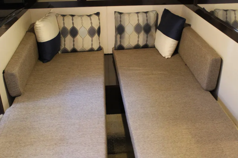 Slide: The Image of Interior cabin of 2017 Sea Ray Sundancer 350 Coupe with twin beds and decorative pillows. - 37