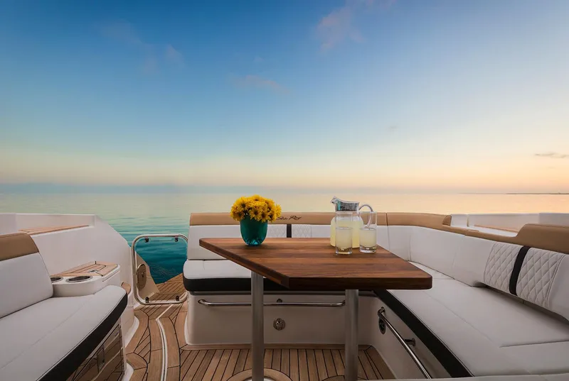 Slide: The Image of 2017 Sea Ray Sundancer 350 Coupe boat side view under clear blue sky. - 6