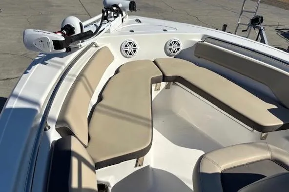 Slide: The Image of 2021 Tidewater 198 CC Adventure boat with beige seating and modern features. - 10