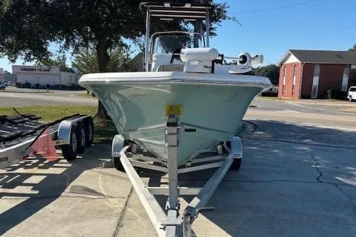 Slide: The Image of 2021 Tidewater 198 CC Adventure boat on trailer, parked outdoors. - 3