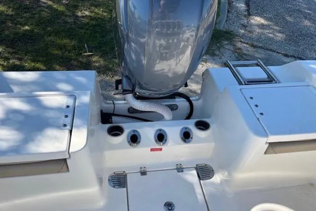 Slide: The Image of 2021 Tidewater 198 CC Adventure boat engine and deck view. - 6