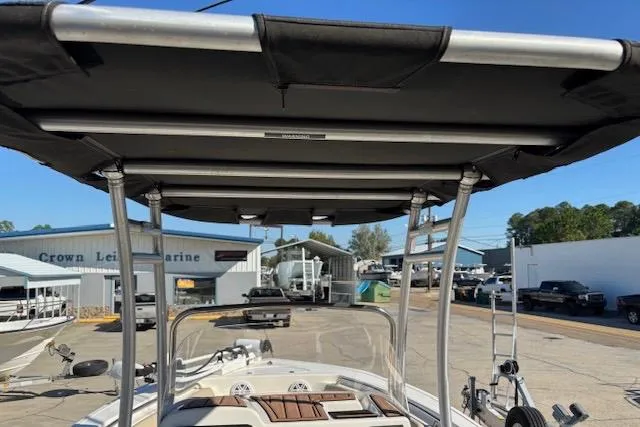 Slide: The Image of 2021 Tidewater 198 CC Adventure boat with T-top at a marine dealership. - 8
