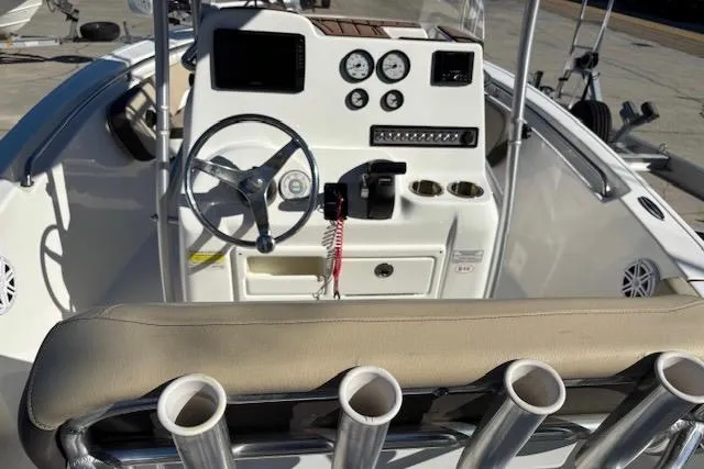 Slide: The Image of 2021 Tidewater 198 CC Adventure boat dashboard with steering wheel and control panel. - 9