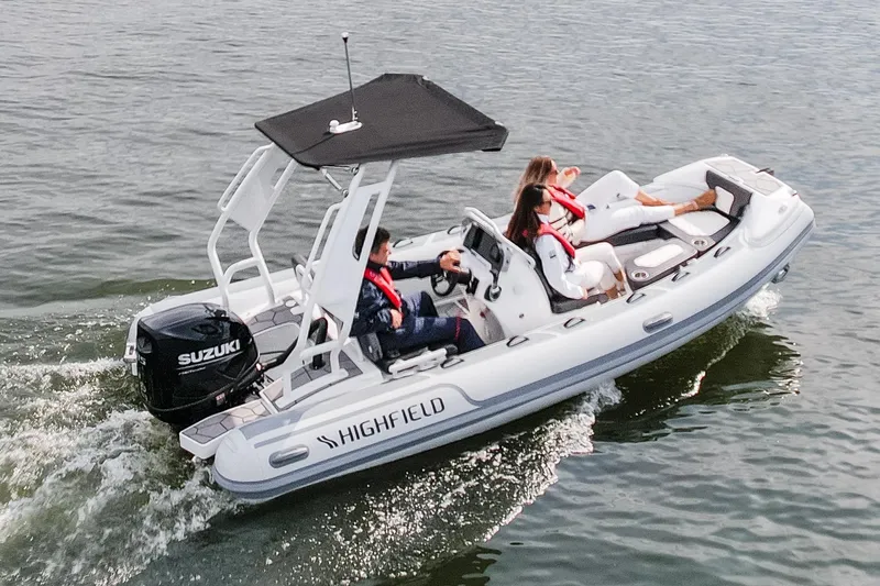 Slide: The Image of Highfield Sport 520 boat cruising on water, 2026 model with Suzuki engine. - 16