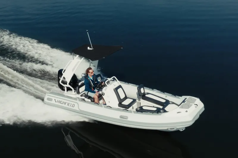Slide: The Image of 2026 Highfield Sport 520 boat with sleek design, modern seating, and canopy. - 3