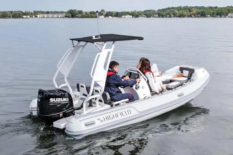 Slide: The Image of Highfield Sport 520 - 2026 Refresh boat seats with diamond-patterned upholstery and cup holders. - 7