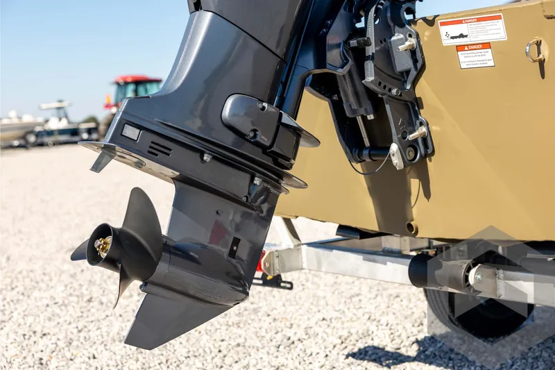 Slide: The Image of Outboard motor on a 2026 G3 1652 VBW boat, displayed on gravel. - 17