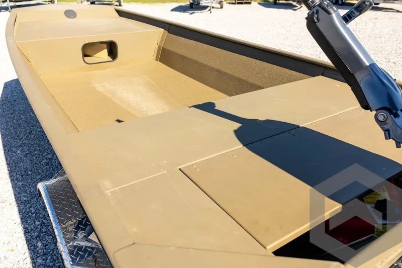 Slide: The Image of 2026 G3 1652 VBW boat interior with motor, displayed on gravel surface. - 26