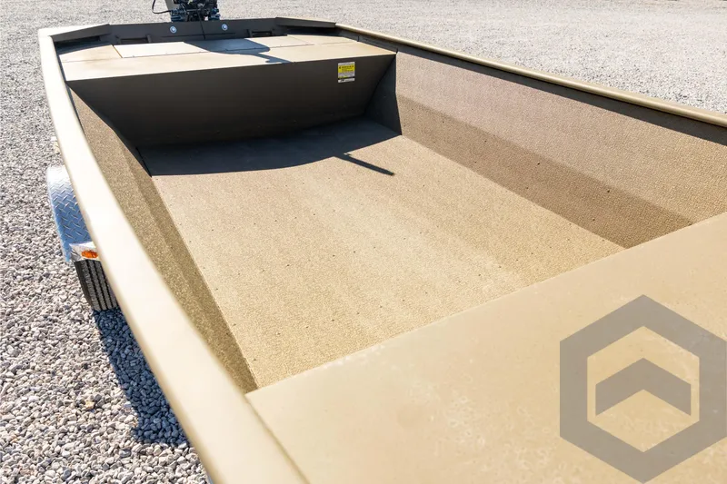 Slide: The Image of 2026 G3 1652 VBW boat interior, empty and spacious, on gravel surface. - 34