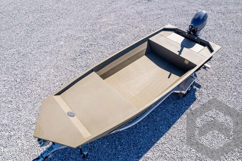 Slide: The Image of 2026 G3 1652 VBW boat on gravel, featuring a compact design and outboard motor. - 41