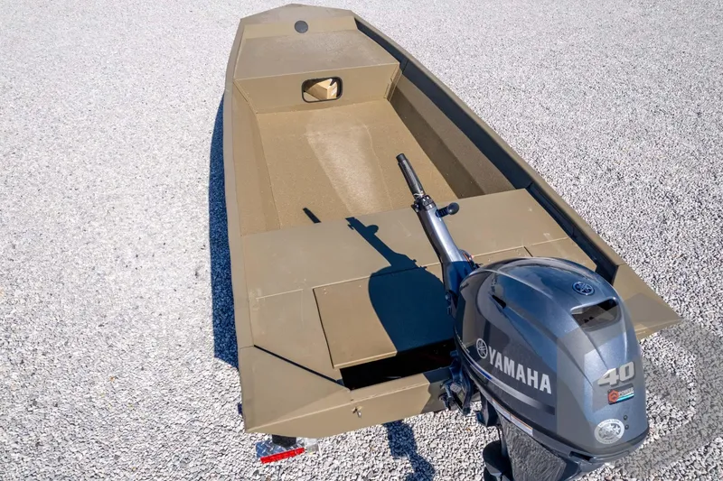 Slide: The Image of 2026 G3 1652 VBW boat with Yamaha 40 outboard motor on gravel surface. - 46