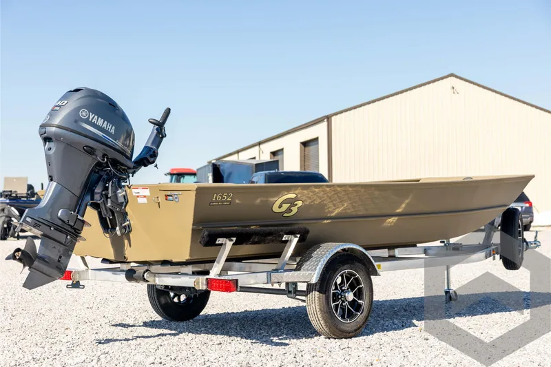 Slide: The Image of 2026 G3 1652 VBW boat with Yamaha motor on trailer, outdoor setting. - 5