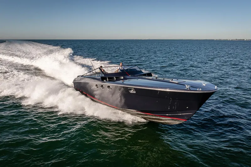 Slide: The Image of Sleek Magnum 50 Bestia yacht cruising on open water, 2000 model. - 12