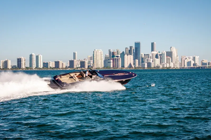 Slide: The Image of Speedboat Magnum 50 Bestia 2000 cruising near city skyline on sunny day. - 16