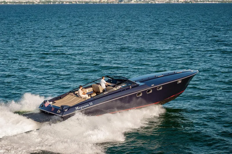 Slide: The Image of Luxury Magnum 50 Bestia yacht cruising on open water, 2000 model. - 2