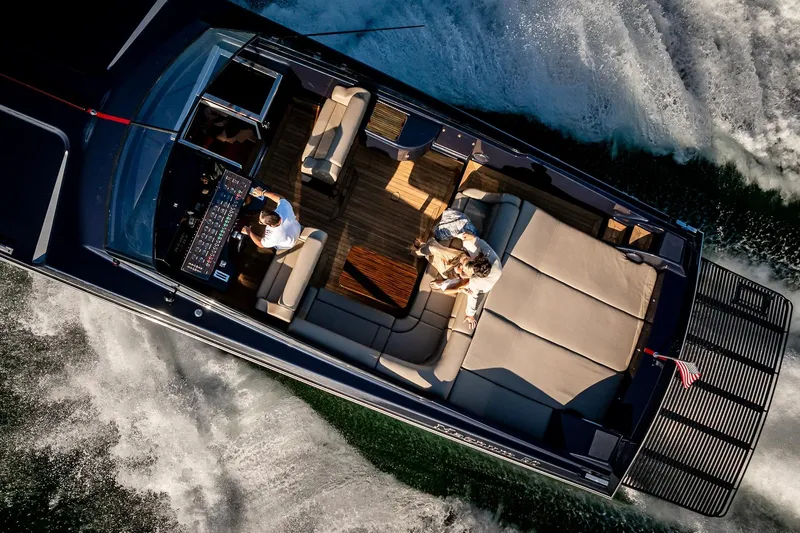 Slide: The Image of Overhead view of a 2000 Magnum 50 Bestia yacht cruising on water. - 22
