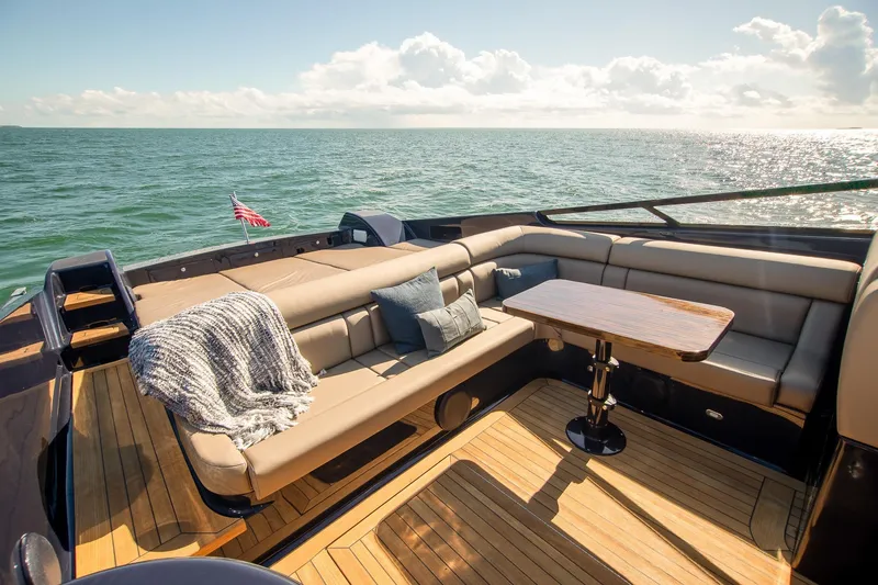 Slide: The Image of Luxurious Magnum 50 Bestia yacht deck with seating, table, and ocean view, 2000 model. - 31