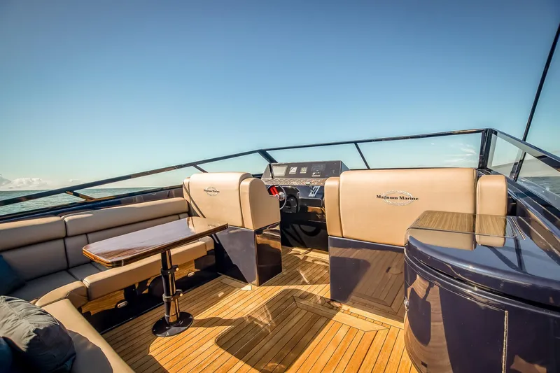 Slide: The Image of Luxurious interior of 2000 Magnum 50 Bestia yacht with elegant seating and wooden flooring. - 33