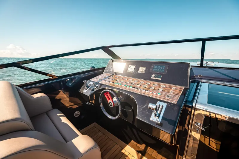 Slide: The Image of Cockpit of 2000 Magnum 50 Bestia yacht with ocean view and modern controls. - 34