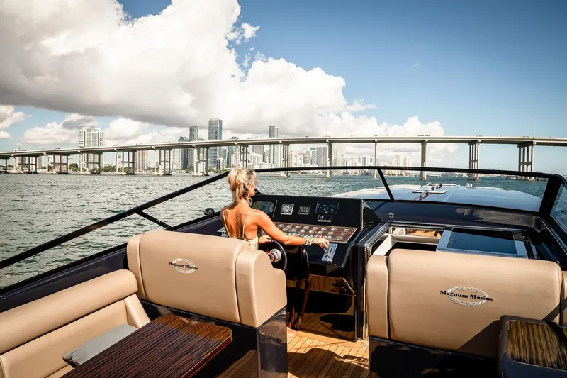 Slide: The Image of Luxury Magnum 50 Bestia yacht cruising near city skyline and bridge, 2000 model. - 39