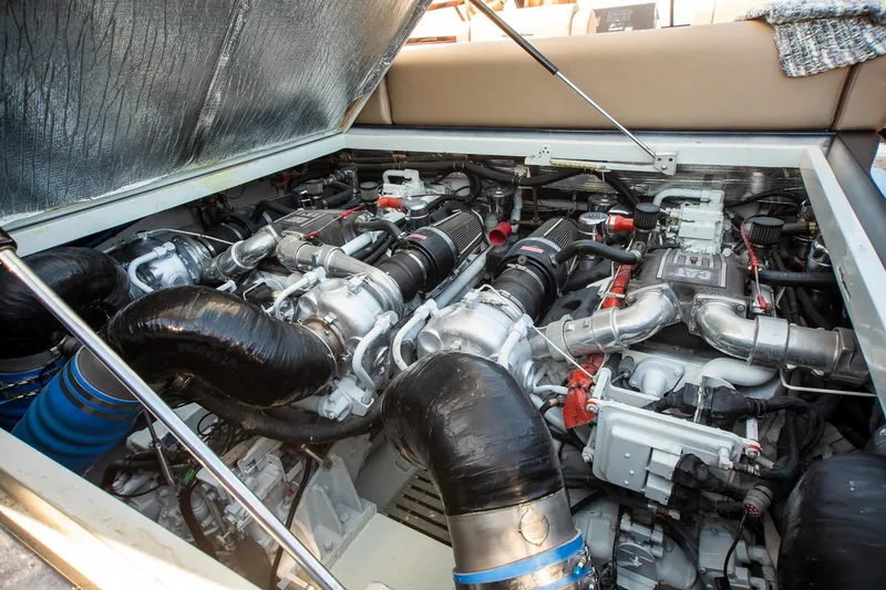 Slide: The Image of Engine compartment of a 2000 Magnum 50 Bestia, showcasing powerful machinery and components. - 41