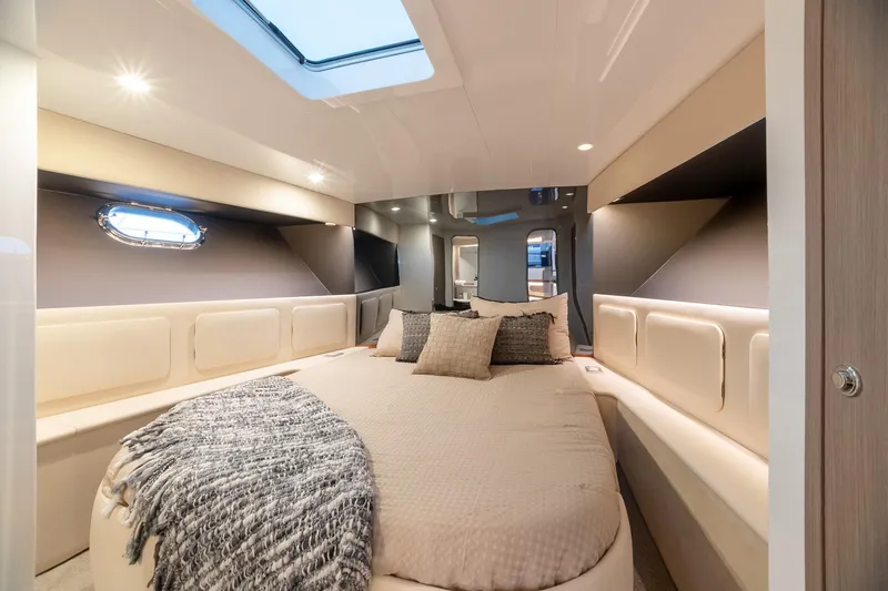 Slide: The Image of Luxurious interior cabin of 2000 Magnum 50 Bestia yacht with elegant bedding and modern design. - 8