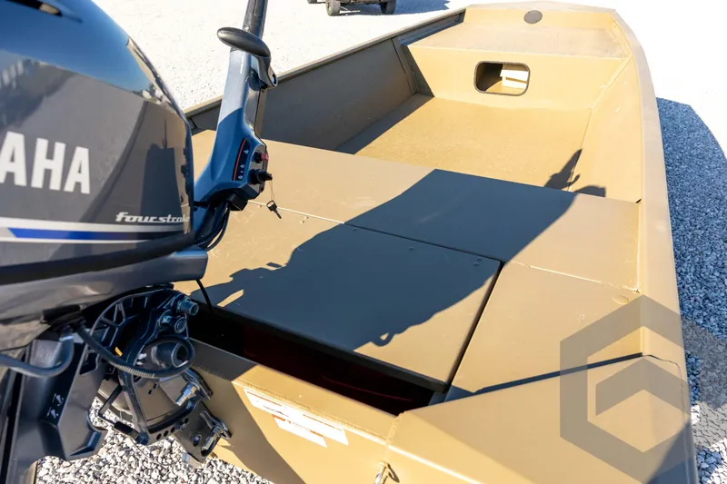 Slide: The Image of 2026 G3 1652 VBW boat with Yamaha four-stroke engine, beige interior, on gravel surface. - 30