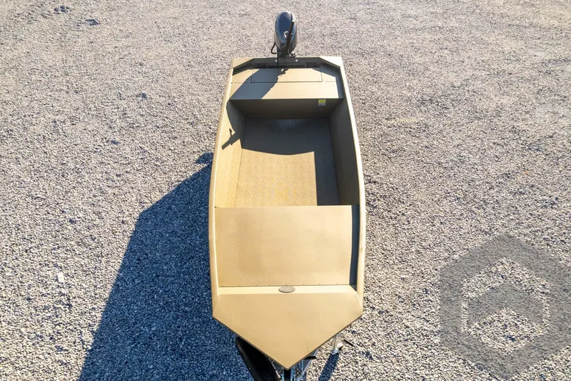 Slide: The Image of 2026 G3 1652 VBW boat on gravel, top view, showcasing open interior design. - 48