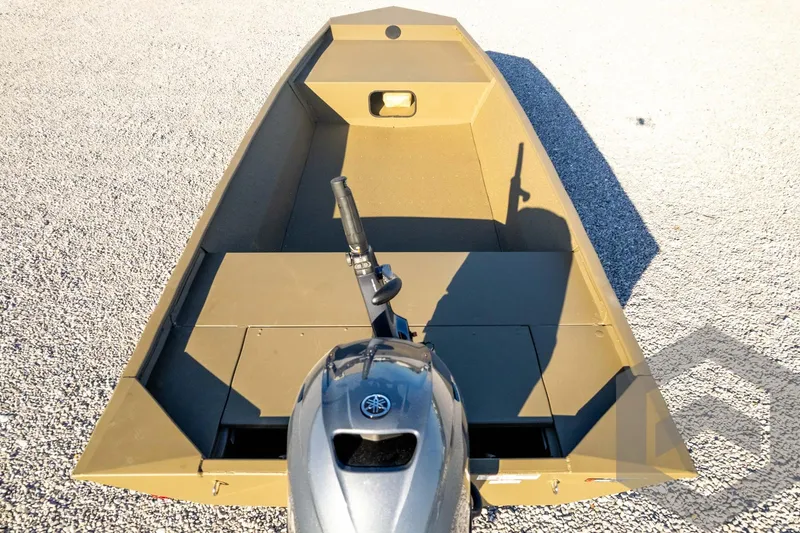 Slide: The Image of 2026 G3 1652 VBW boat with outboard motor on gravel surface. - 52