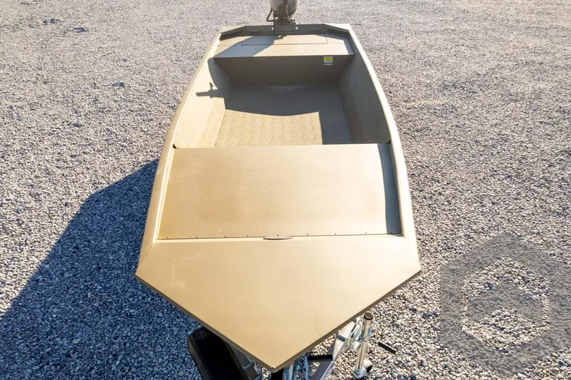 Slide: The Image of 2026 G3 1652 VBW boat on gravel, showcasing open deck design. - 53