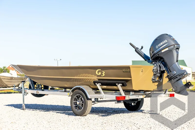 Slide: The Image of 2026 G3 1652 VBW boat with Yamaha motor on a trailer, outdoors. - 7