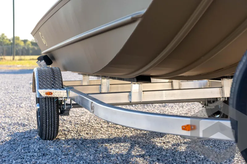 Slide: The Image of 2026 G3 1652 VBW boat on trailer, close-up view of hull and wheels. - 13