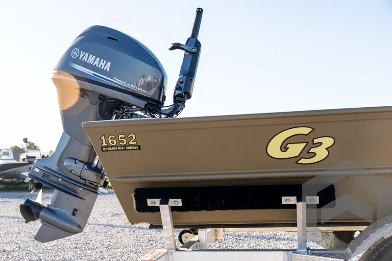 Slide: The Image of 2026 G3 1652 VBW boat with Yamaha outboard motor on trailer. - 16