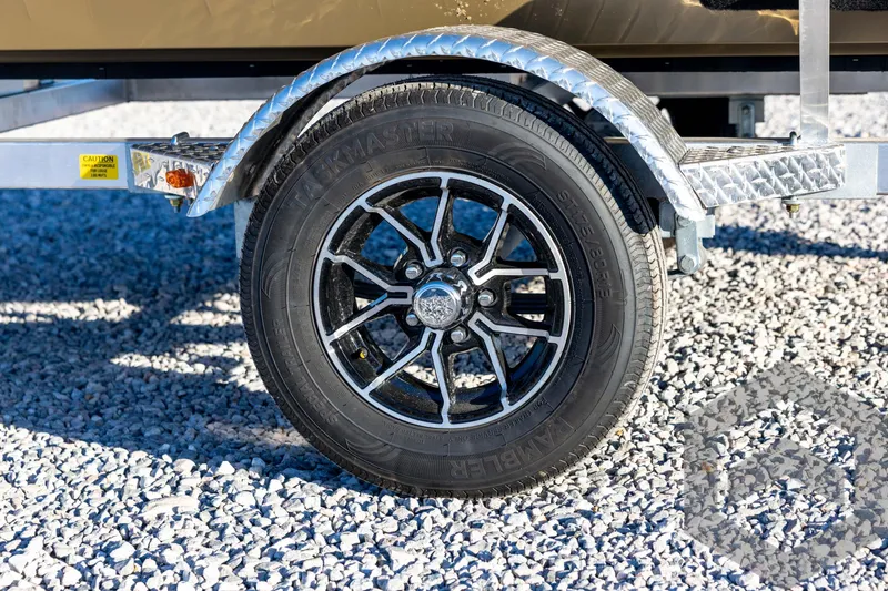 Slide: The Image of Trailer wheel of 2026 G3 1652 VBW on gravel surface. - 24