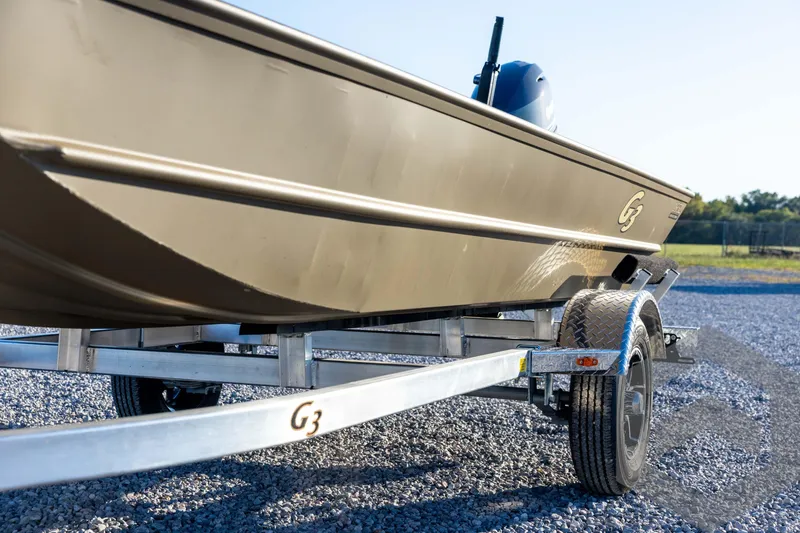 Slide: The Image of 2026 G3 1652 VBW boat on trailer, parked on gravel, sunny day. - 28