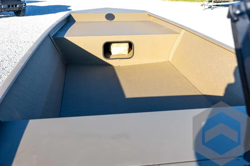 Slide: The Image of 2026 G3 1652 VBW boat interior with storage compartment, shown on gravel surface. - 31