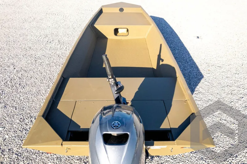 Slide: The Image of 2026 G3 1652 VBW boat with outboard motor on gravel surface. - 51