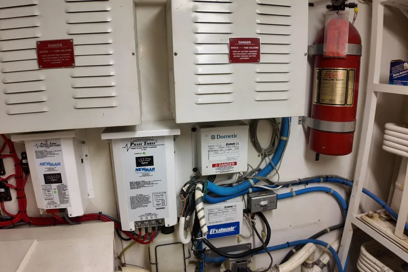Slide: The Image of Electrical panel and fire extinguisher in 1987 Viking Gulfstar boat engine room. - 14