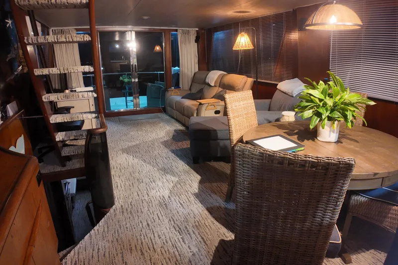 Slide: The Image of Luxurious 1987 Viking Gulfstar yacht interior with cozy seating, dining area, and elegant decor. - 16