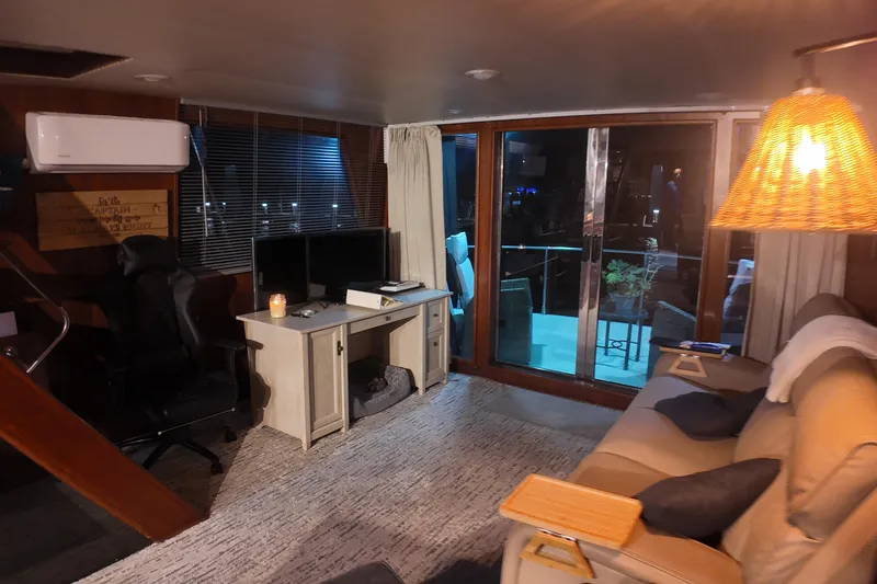 Slide: The Image of Cozy interior of 1987 Viking Gulfstar yacht with modern furnishings and ambient lighting. - 19