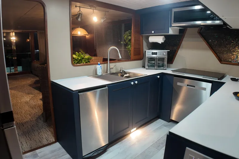 Slide: The Image of Modern kitchen interior on 1987 Viking Gulfstar yacht with sleek appliances and stylish design. - 26