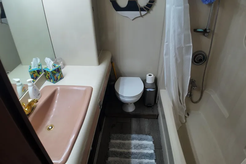 Slide: The Image of Bathroom interior of 1987 Viking Gulfstar yacht with sink, toilet, and shower. - 39
