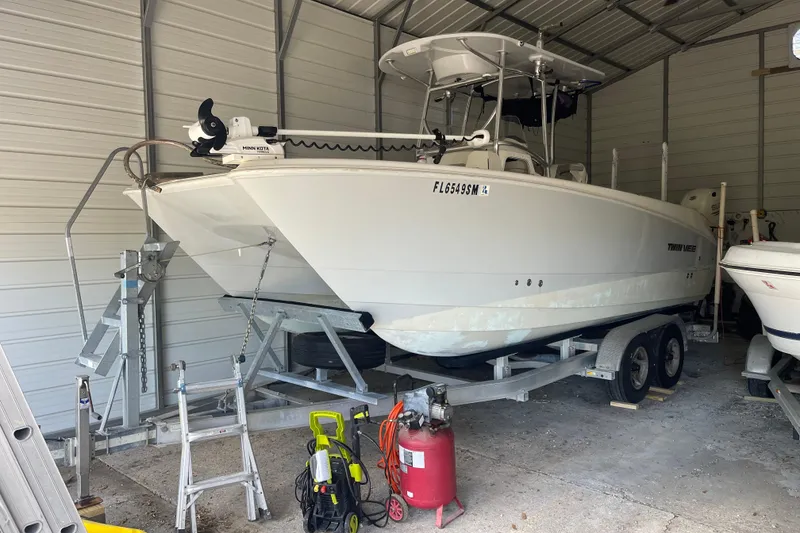 Slide: The Image of 2020 Twin Vee 230 JP CC boat on trailer in a garage. - 5