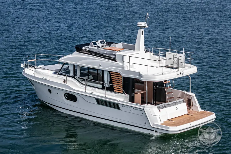 Slide: The Image of 2026 Beneteau Swift Trawler 41 Fly cruising on open water. - 14