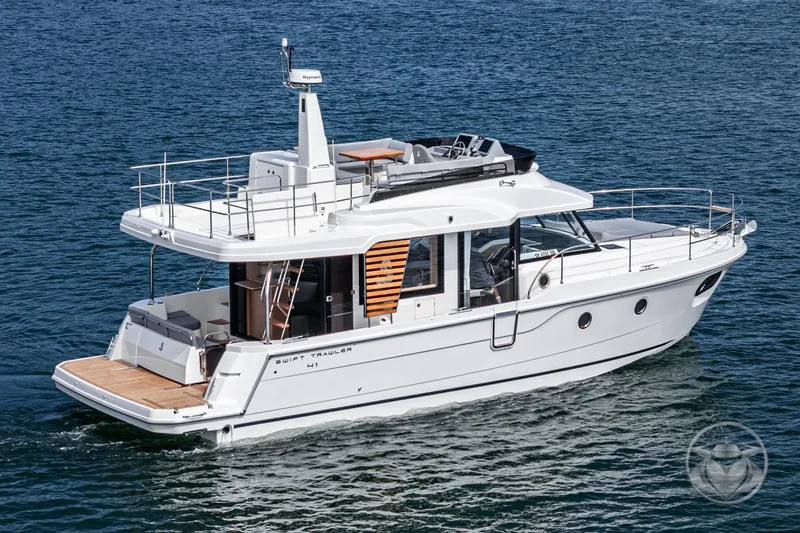 Slide: The Image of 2026 Beneteau Swift Trawler 41 Fly cruising on open water. - 15