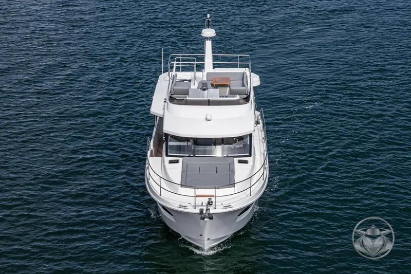 Slide: The Image of 2026 Beneteau Swift Trawler 41 Fly cruising on open water, front view. - 23