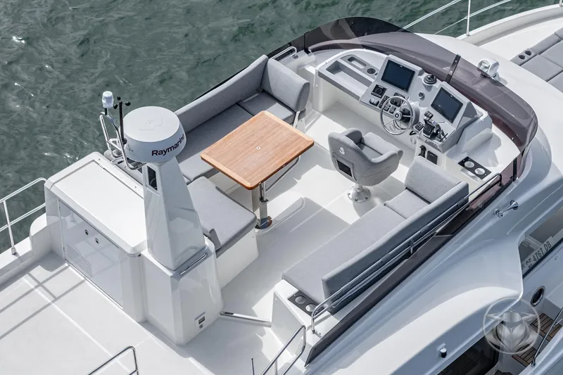 Slide: The Image of 2026 Beneteau Swift Trawler 41 Flybridge with modern helm and seating area. - 29