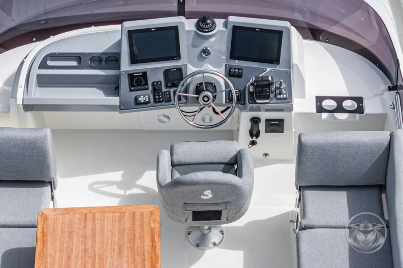 Slide: The Image of Flybridge helm of 2026 Beneteau Swift Trawler 41 Fly with modern controls and seating. - 31