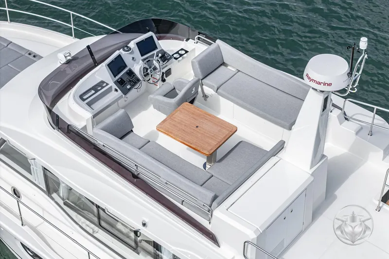 Slide: The Image of 2026 Beneteau Swift Trawler 41 Flybridge with seating and navigation equipment. - 34